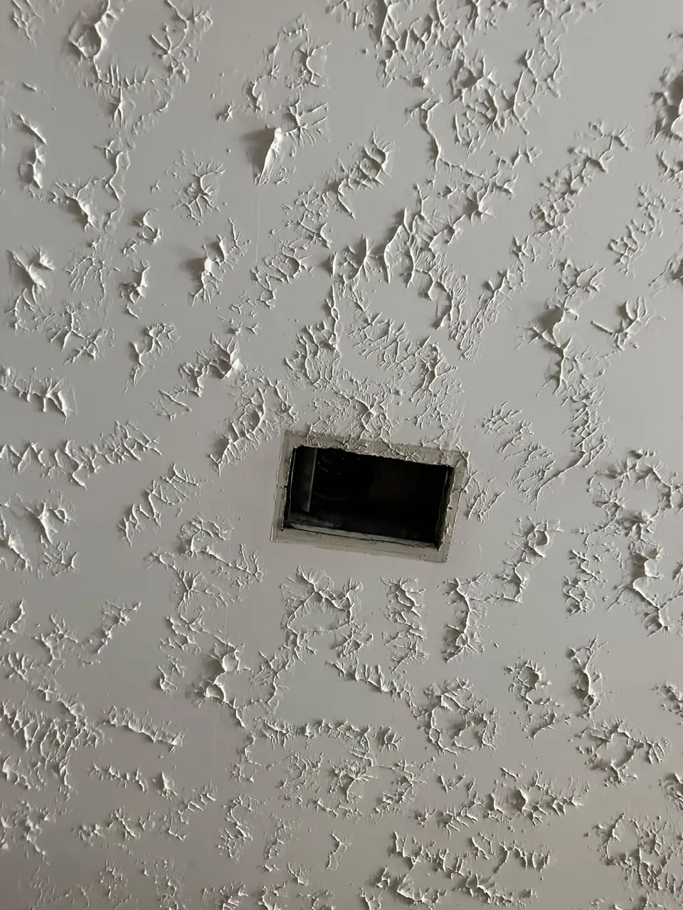 Ceiling air vent opening ready for cleaning