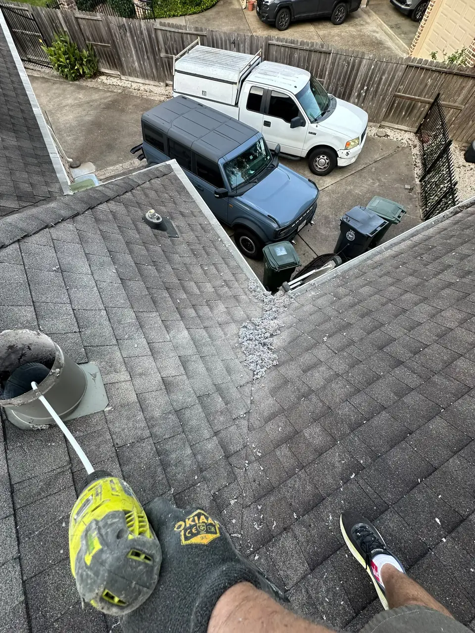 Cleaning a roof dryer vent on a two-story Houston home